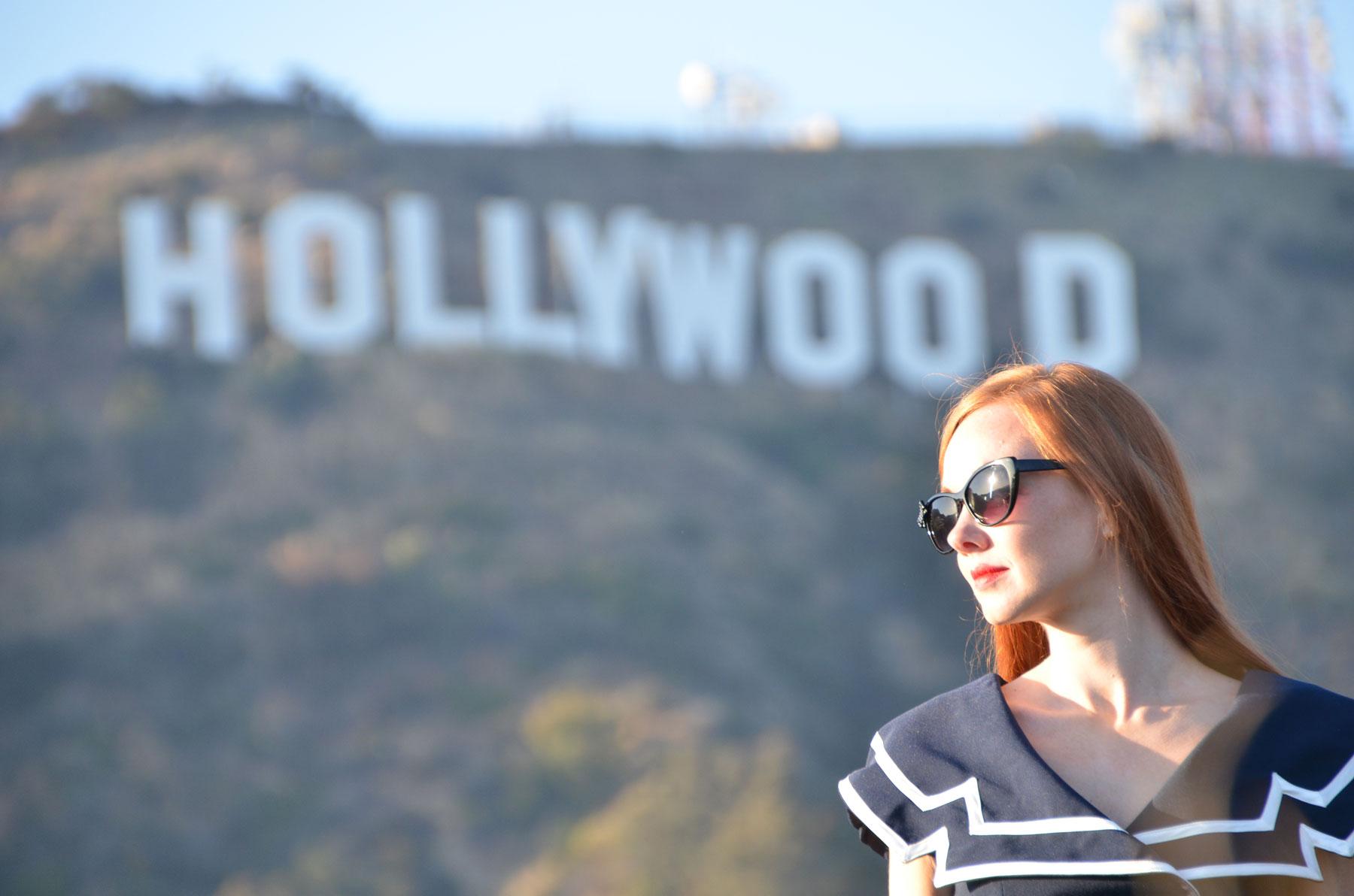 Standing in front of the Hollywood sign, California