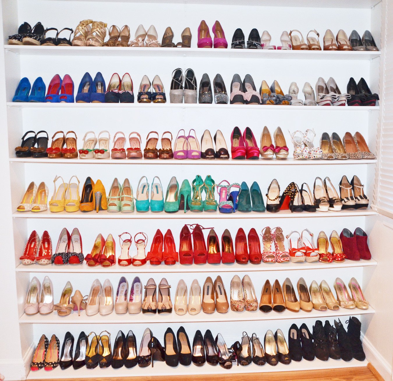 Shoe organisation: colourful shoes stored on shelves
