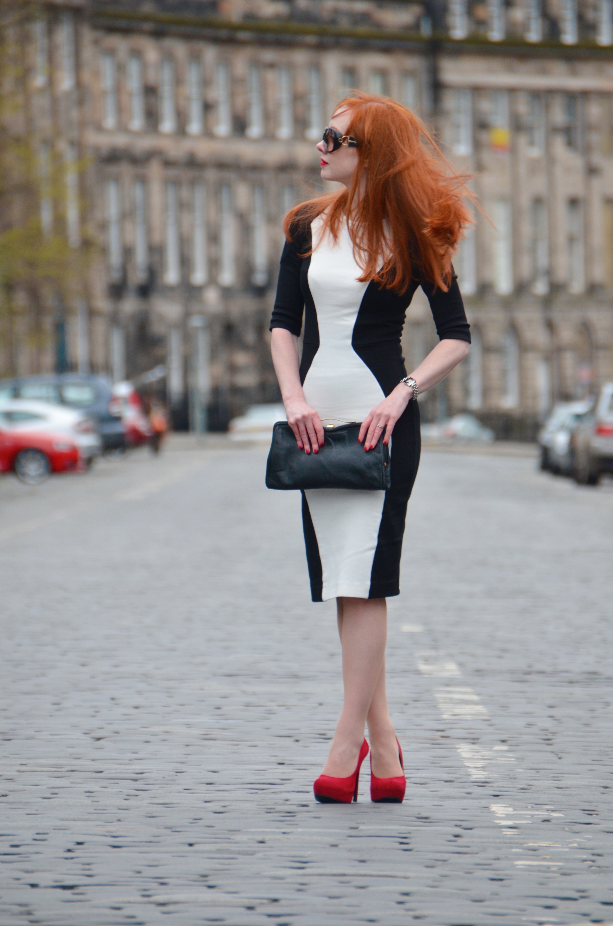 black and white dress with red high heel shoes