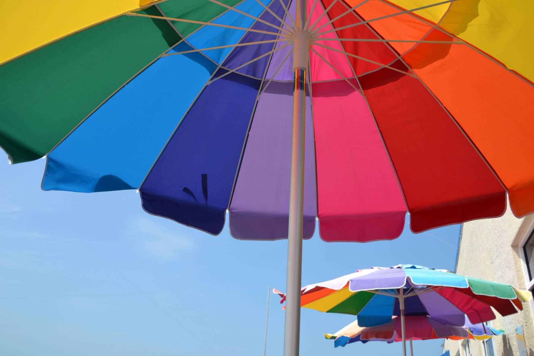 colourful beach side umbrellas