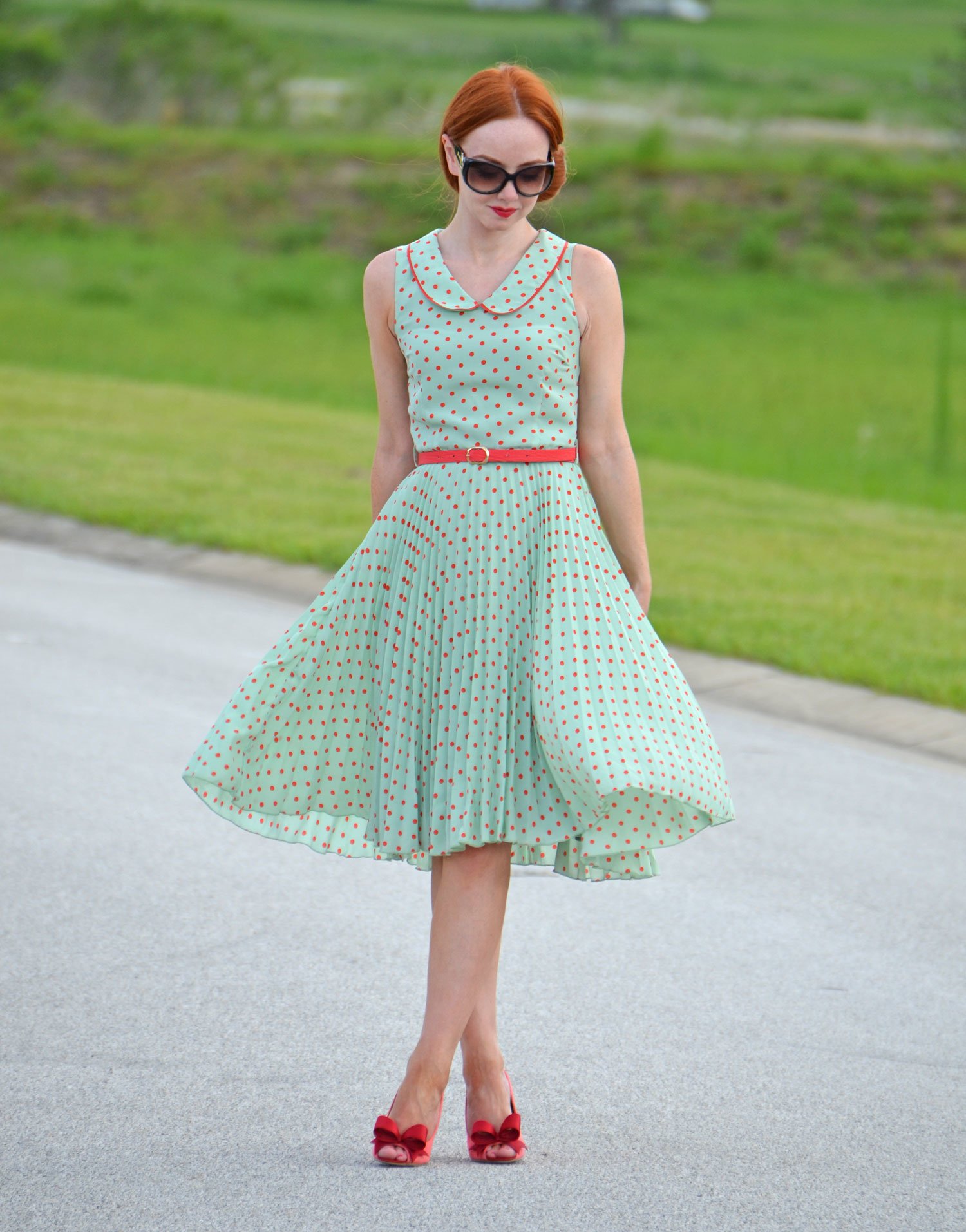 mint green dress with flared skirt and coral dots
