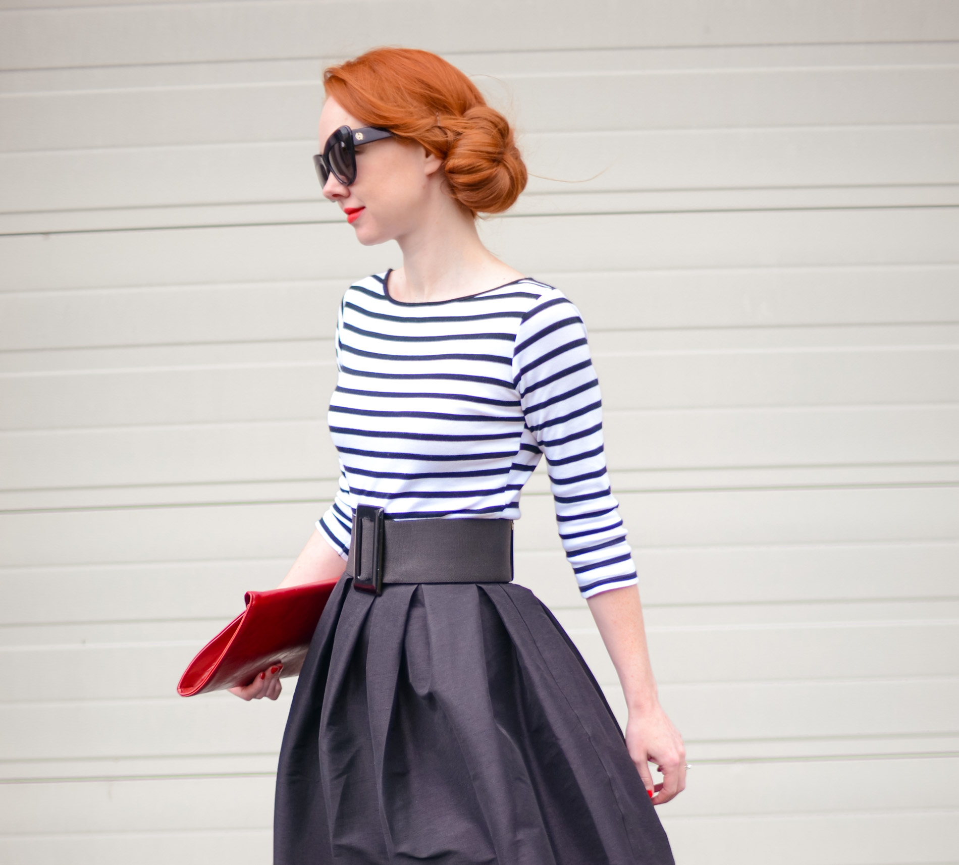 fashion blogger in stripe top and full skirt
