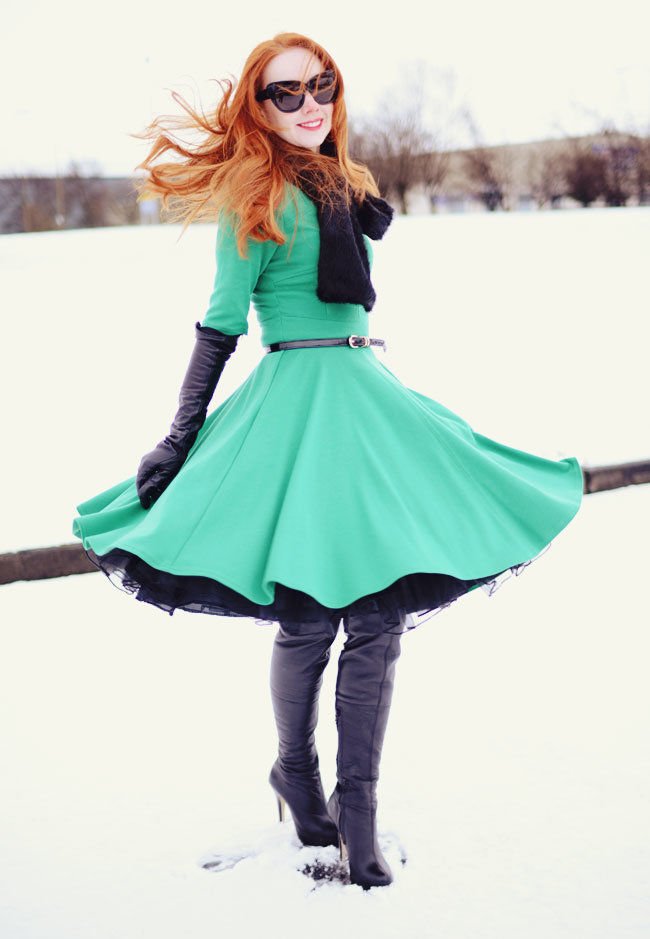 redhead in green 50s style dress