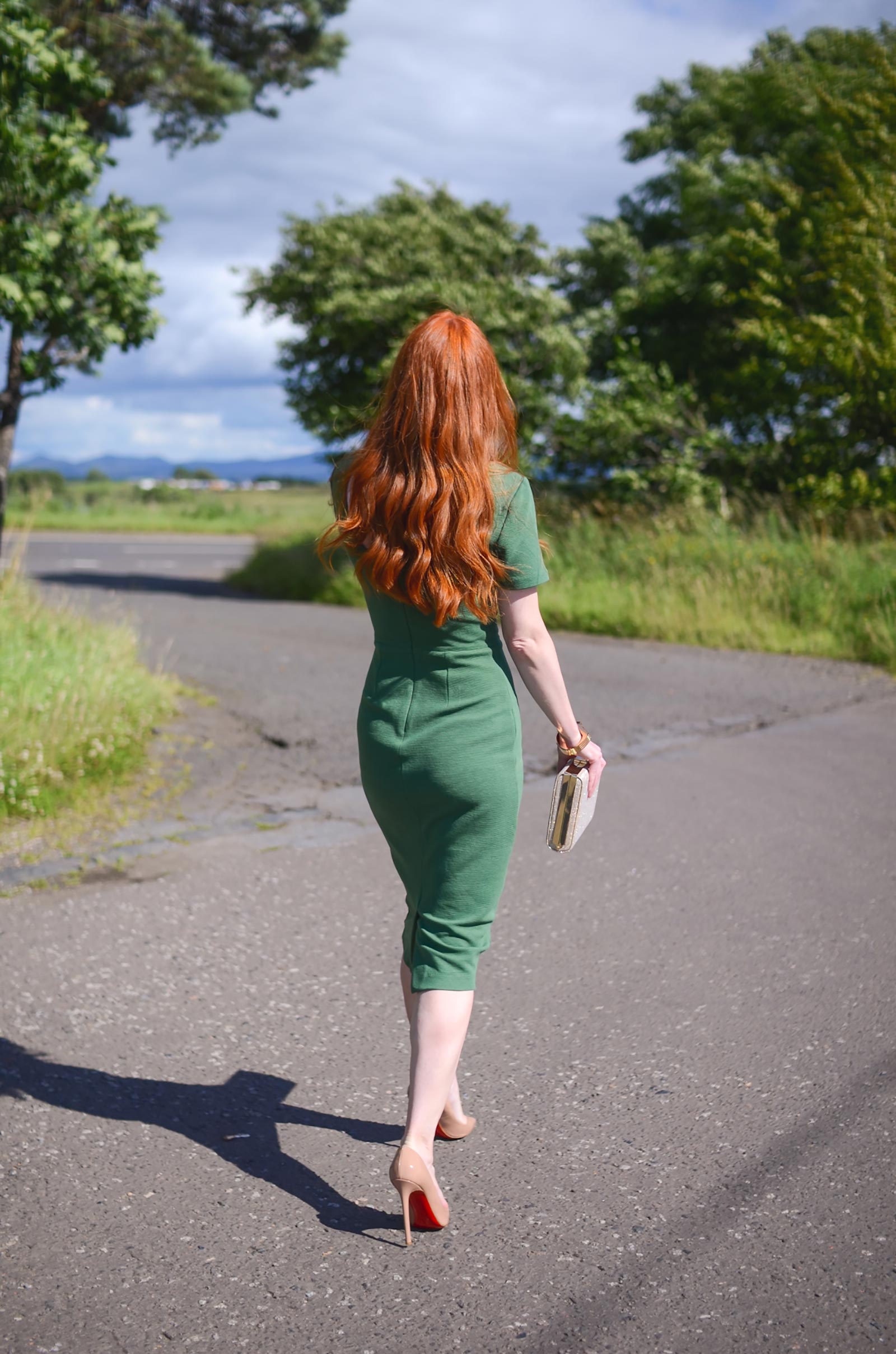 redhead in green dress