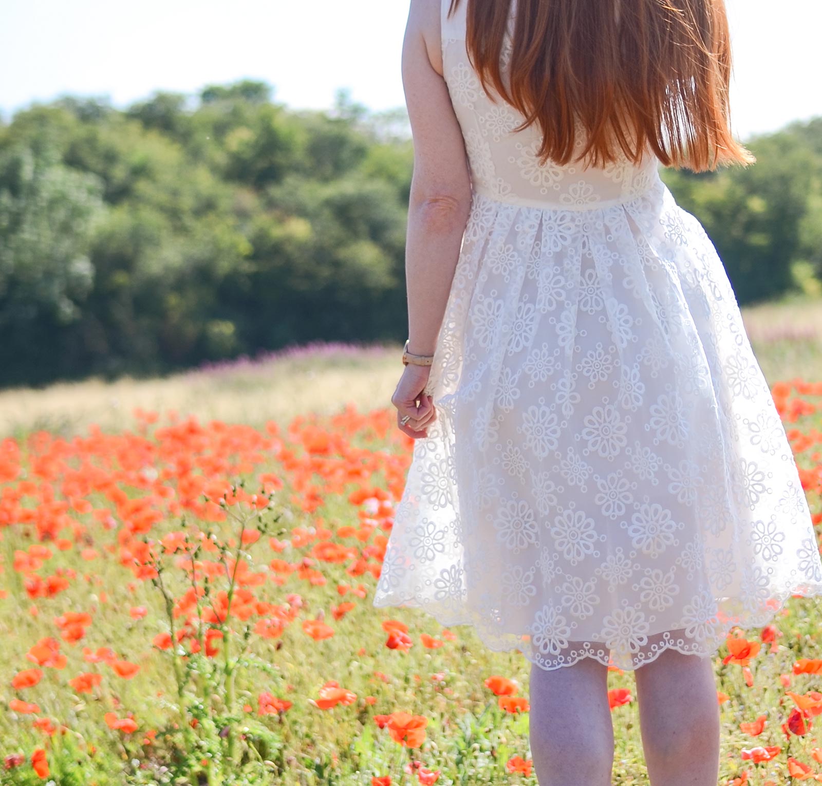 white dress in poppy field