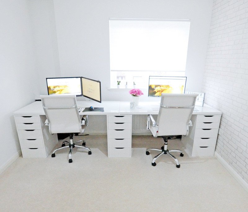 all-white home office with Ikea Alex cabinets and two desks
