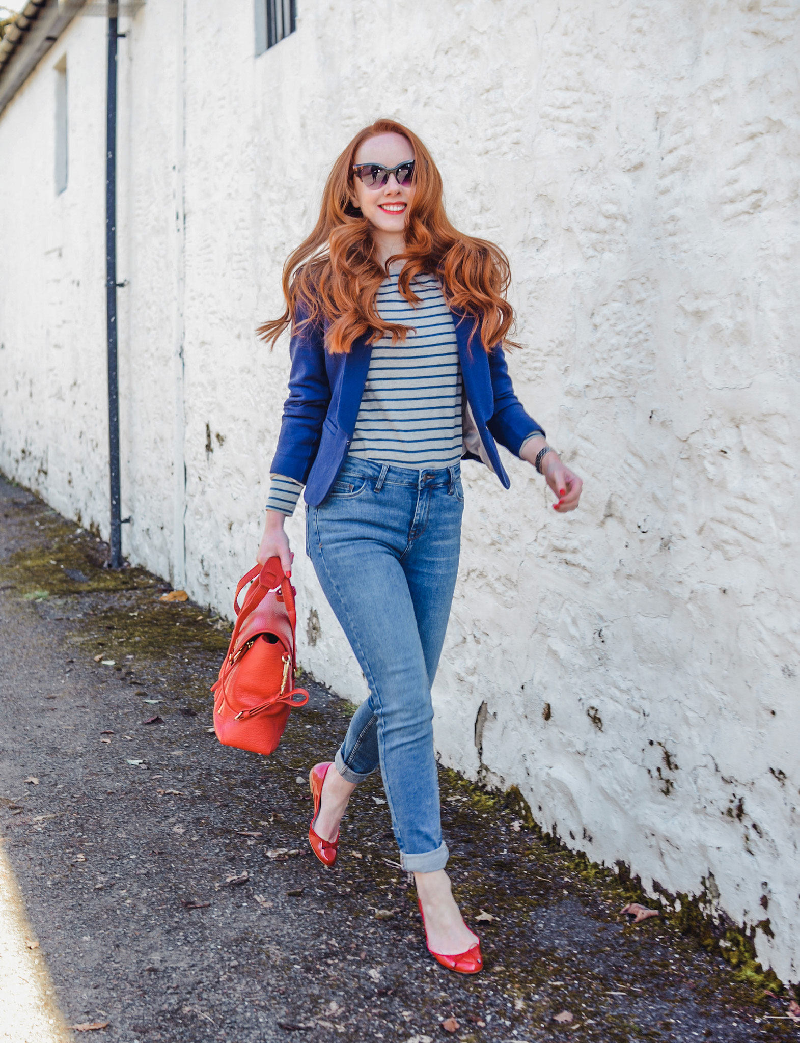 casual spring outfit featuring jeans, breton top and blazer