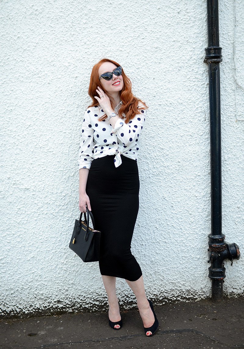 non-maternity maternity outfit: stretch black dress with knotted polka dot shirt
