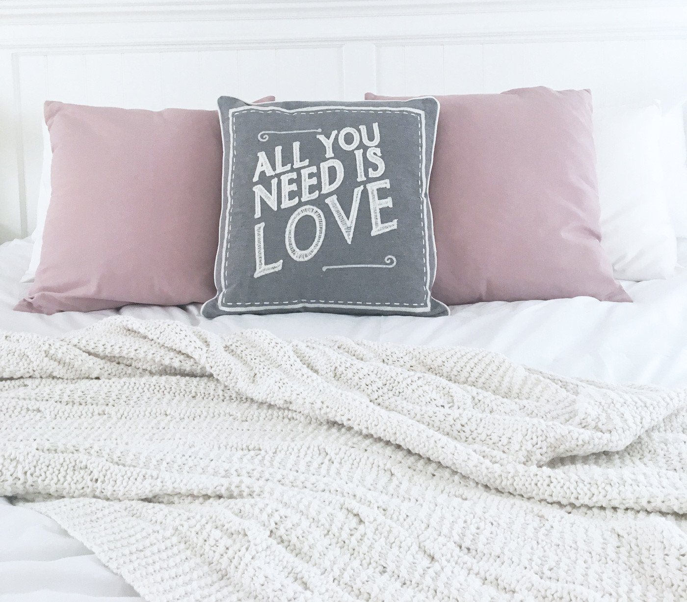 grey "All You Need is Love" cushion