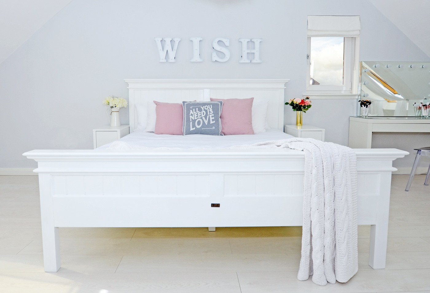 white wooden super kingsize bed