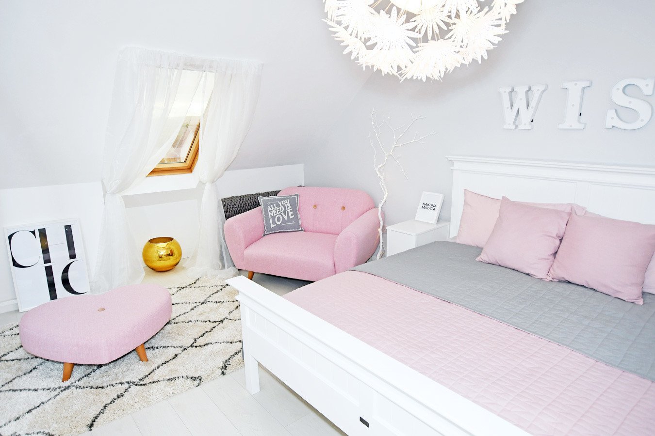 pink sofa in white and grey master bedroom