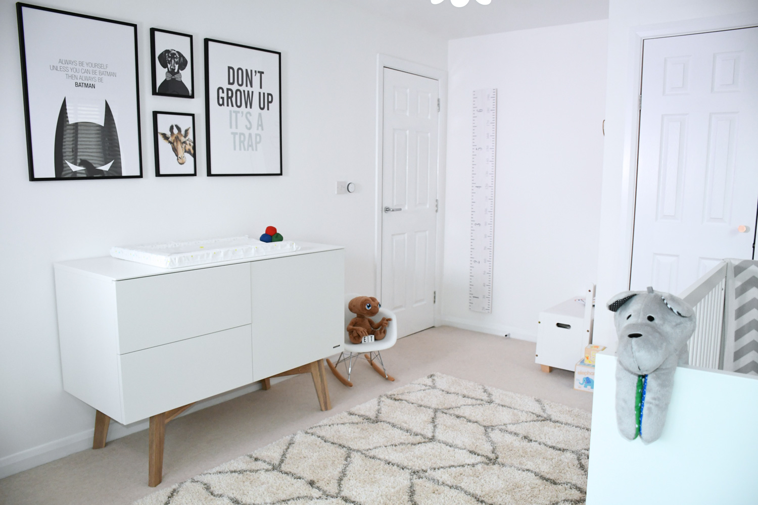 Scandinavian nursery for baby boy with neutral colours, scandi-style changing table and rug