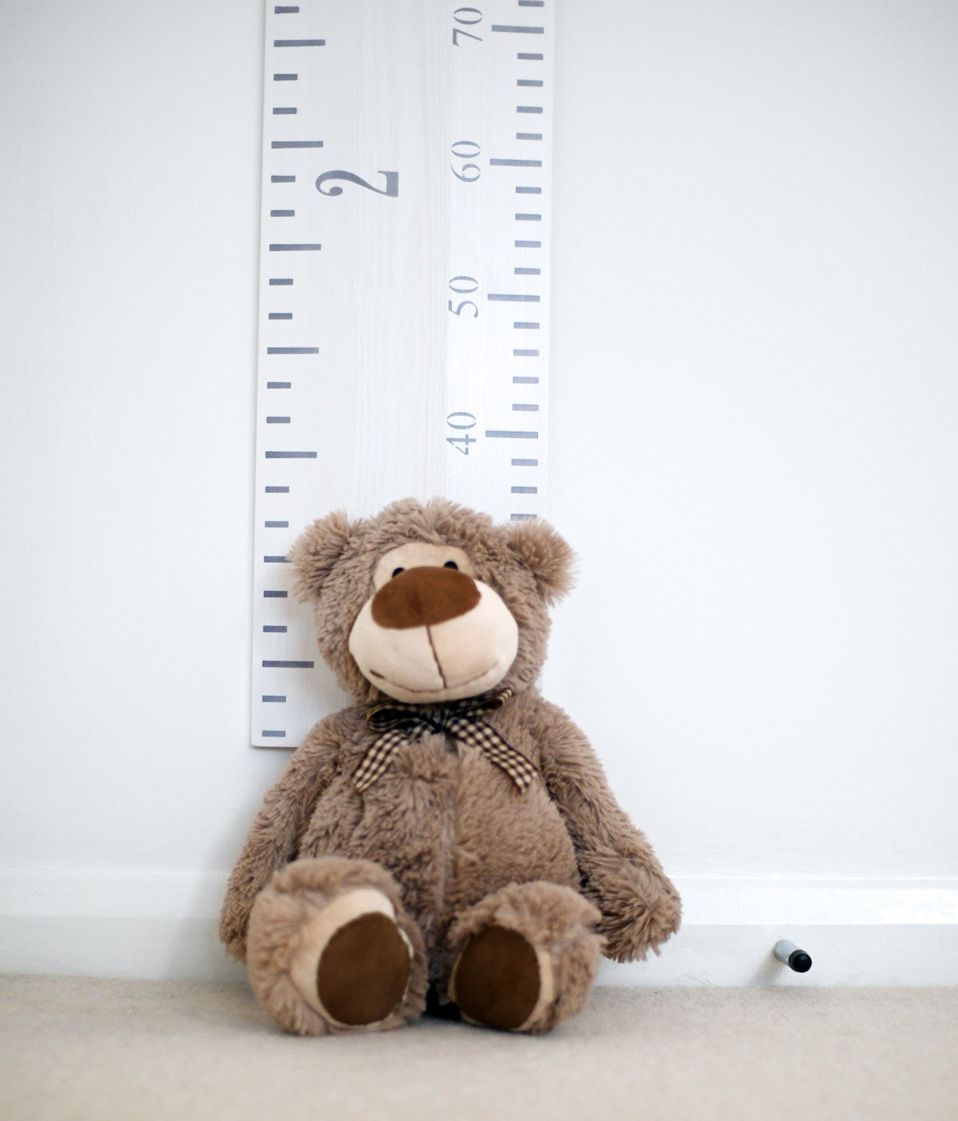 oversized wooden ruler in baby's nursery