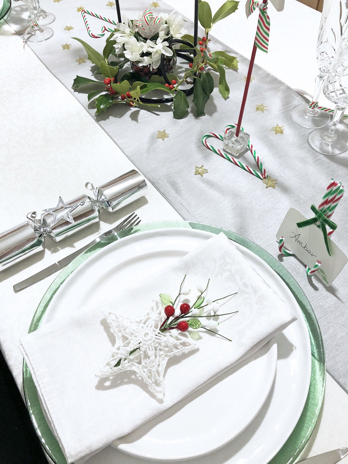 Christmas place setting with holly berries