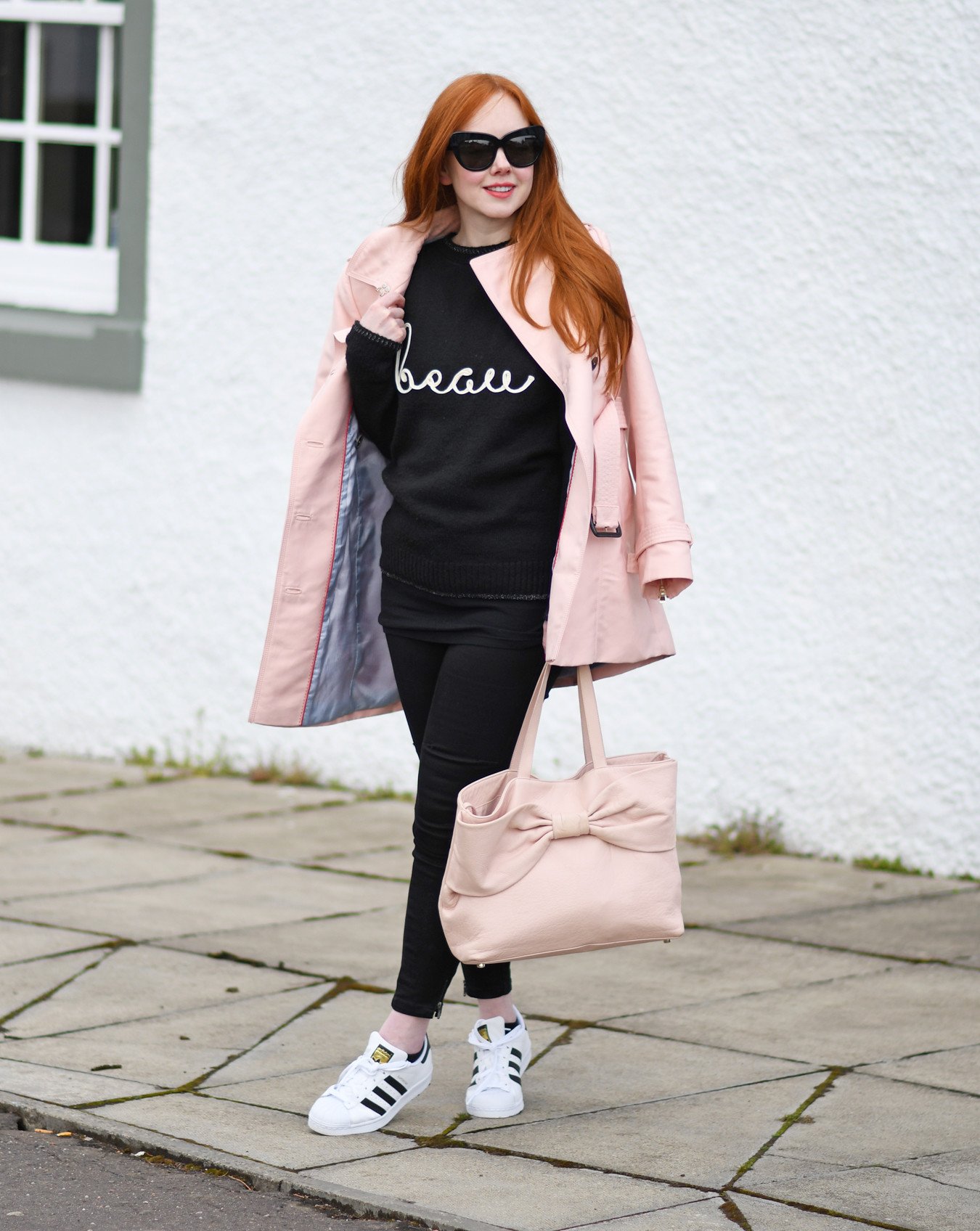black slogan sweater with pink trench coat