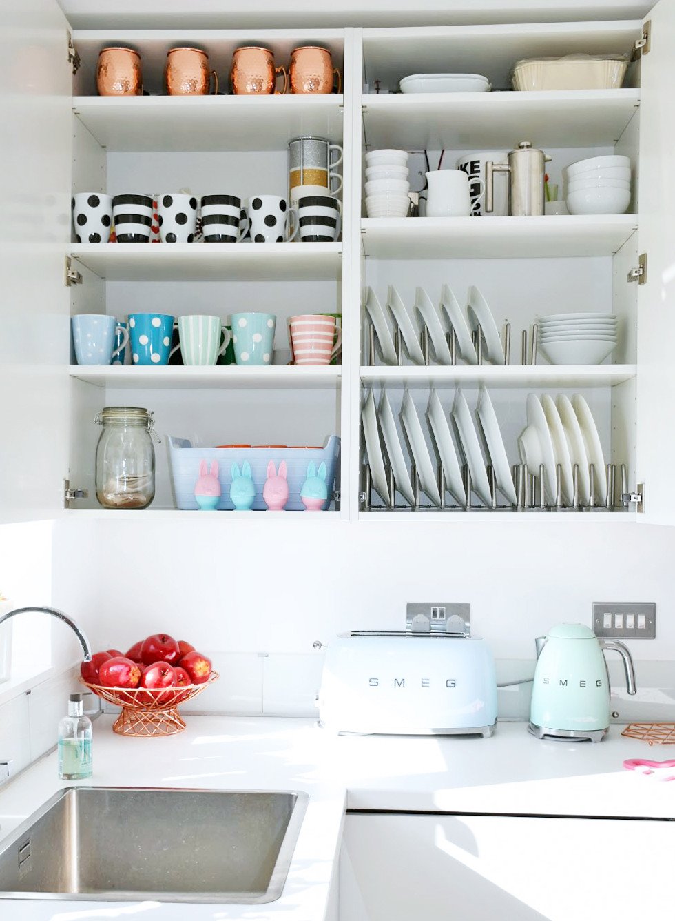 organised kitchen cupboard: mugs and plates
