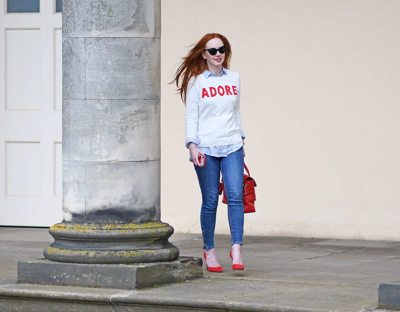 jeans, slogan sweater and high heels