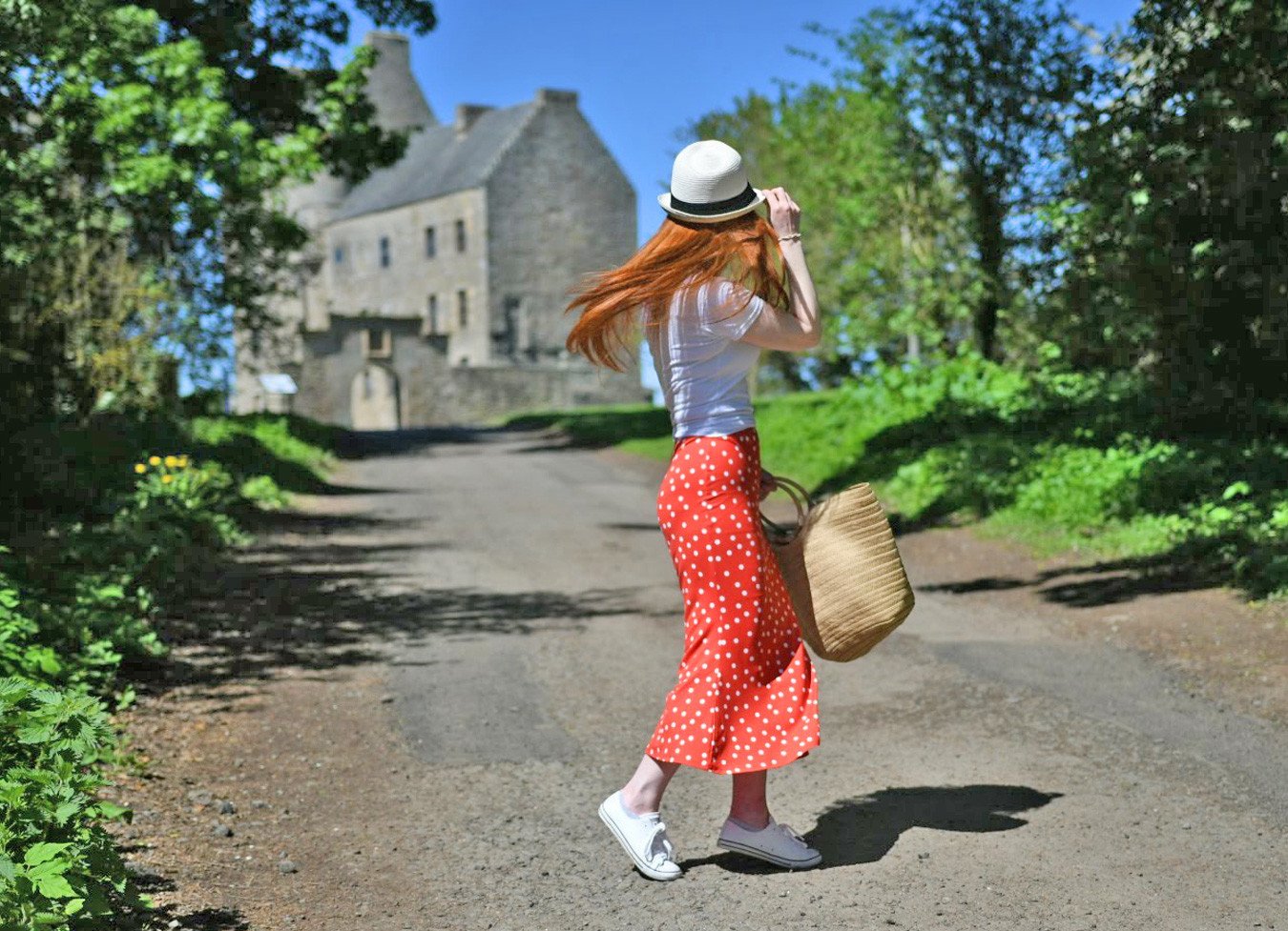 walking towards Lallybroch - a.k.a Midhope Castle - an Outlander filming location in Scotland