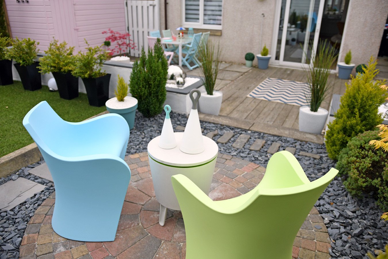 colourful statement chairs in urban garden