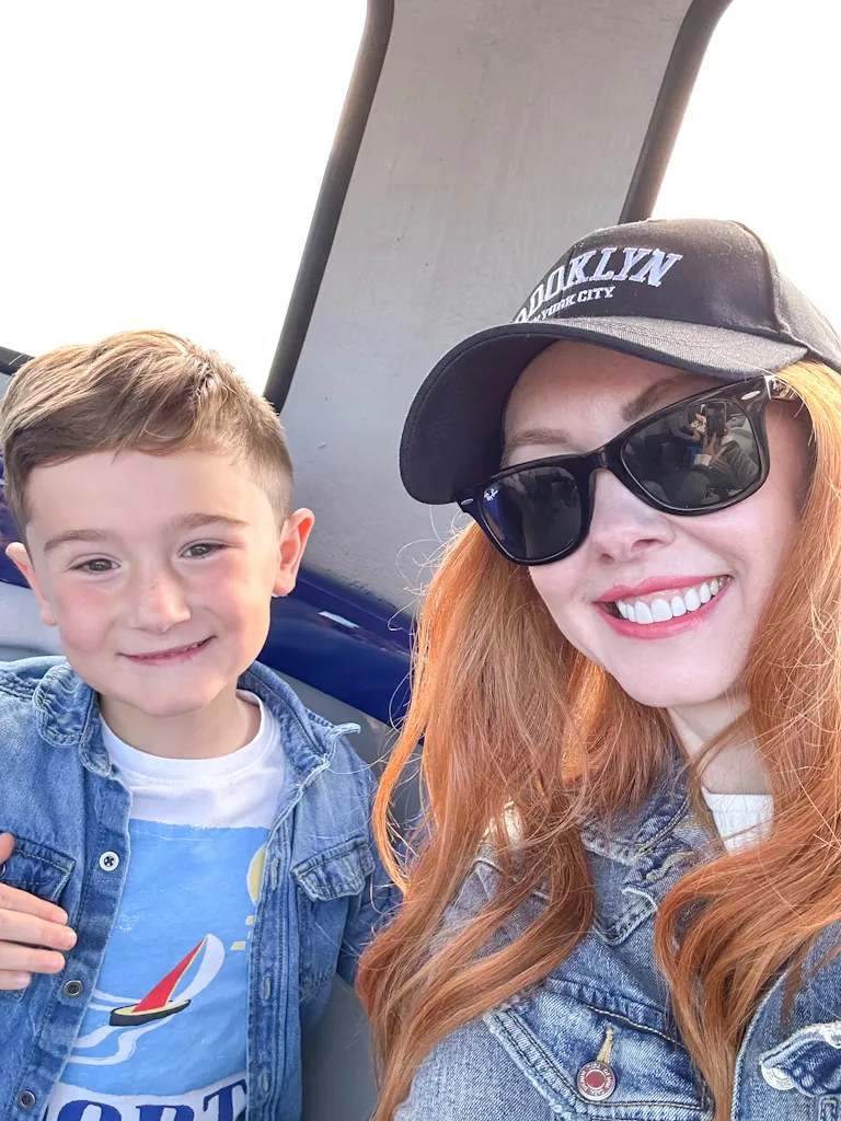 Amber and Max on the ferry to Loch Leven Island and castle