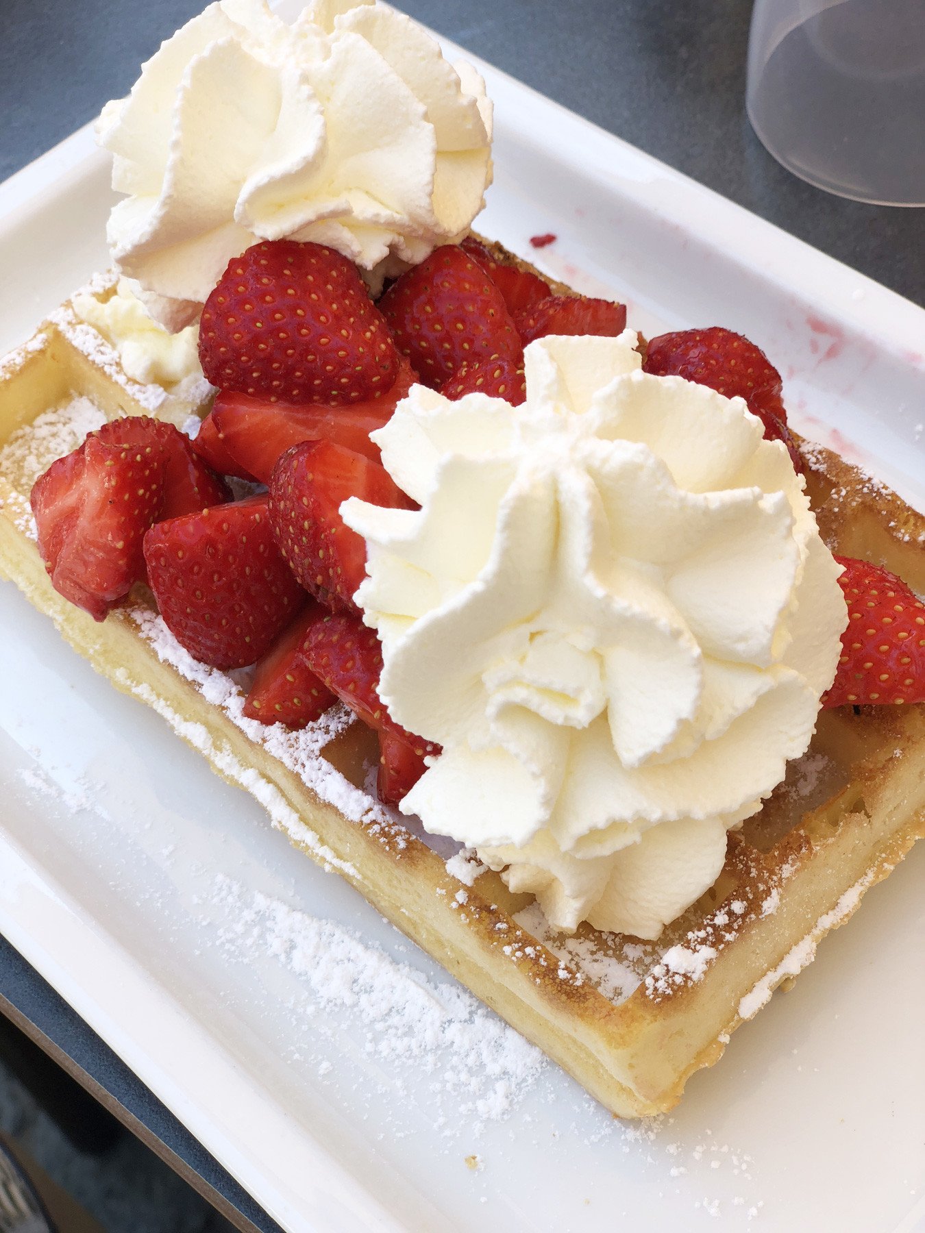 Belgian waffles with strawberries and cream