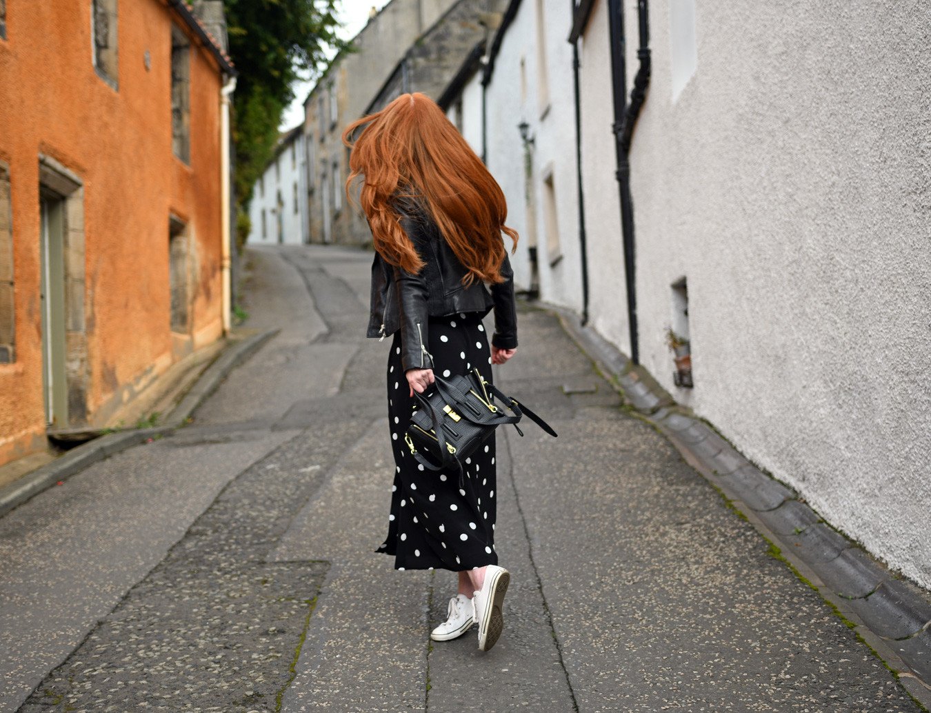 red hair and polka dot skirt