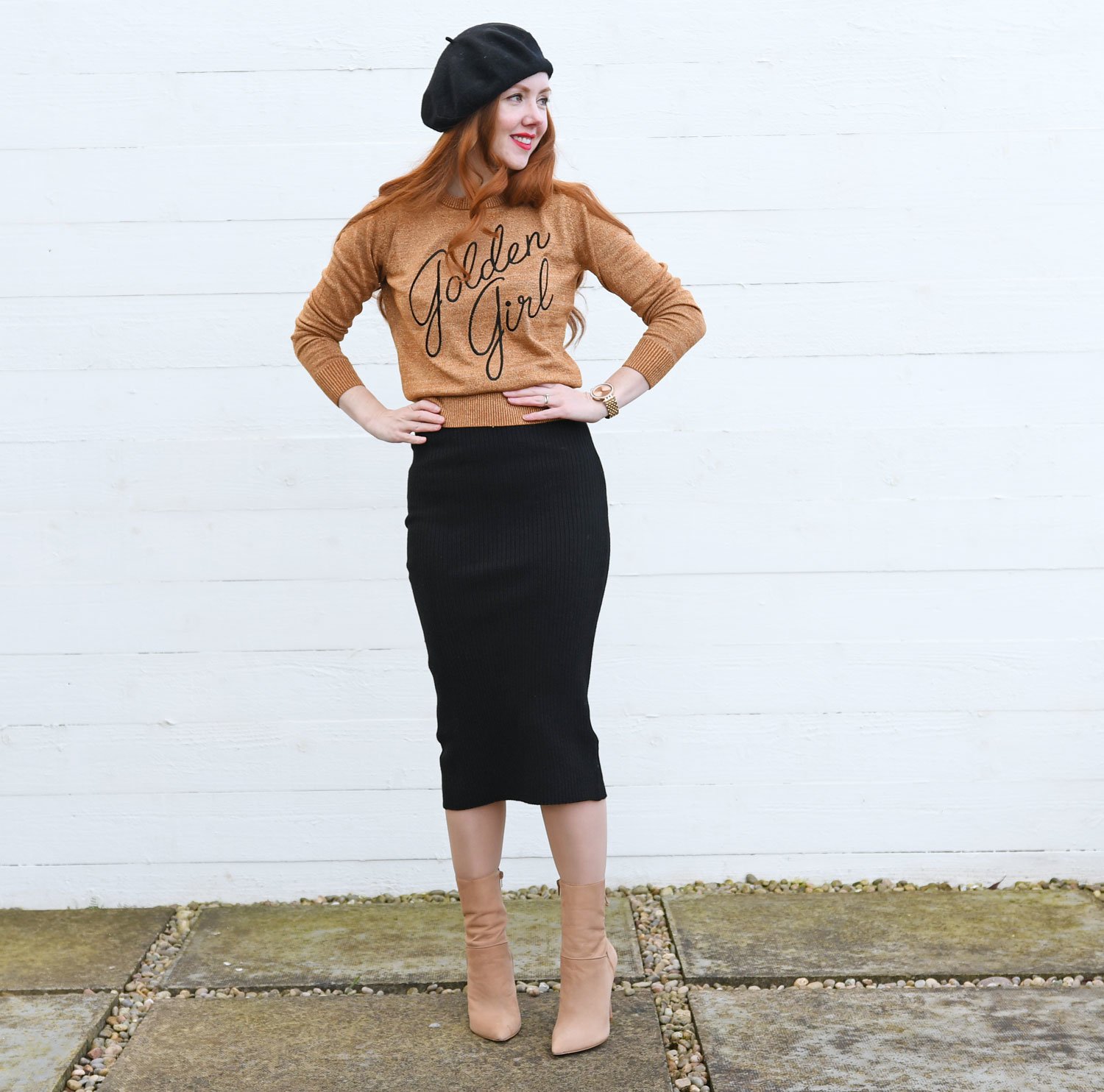 pin-up inspired outfit featuring gold slogan sweater with black pencil skirt and boots