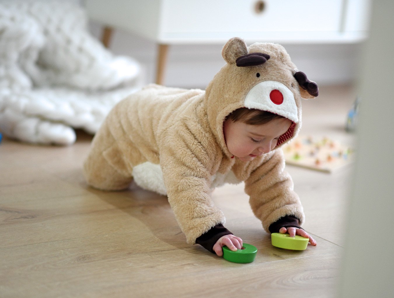 baby in reindeer onesie