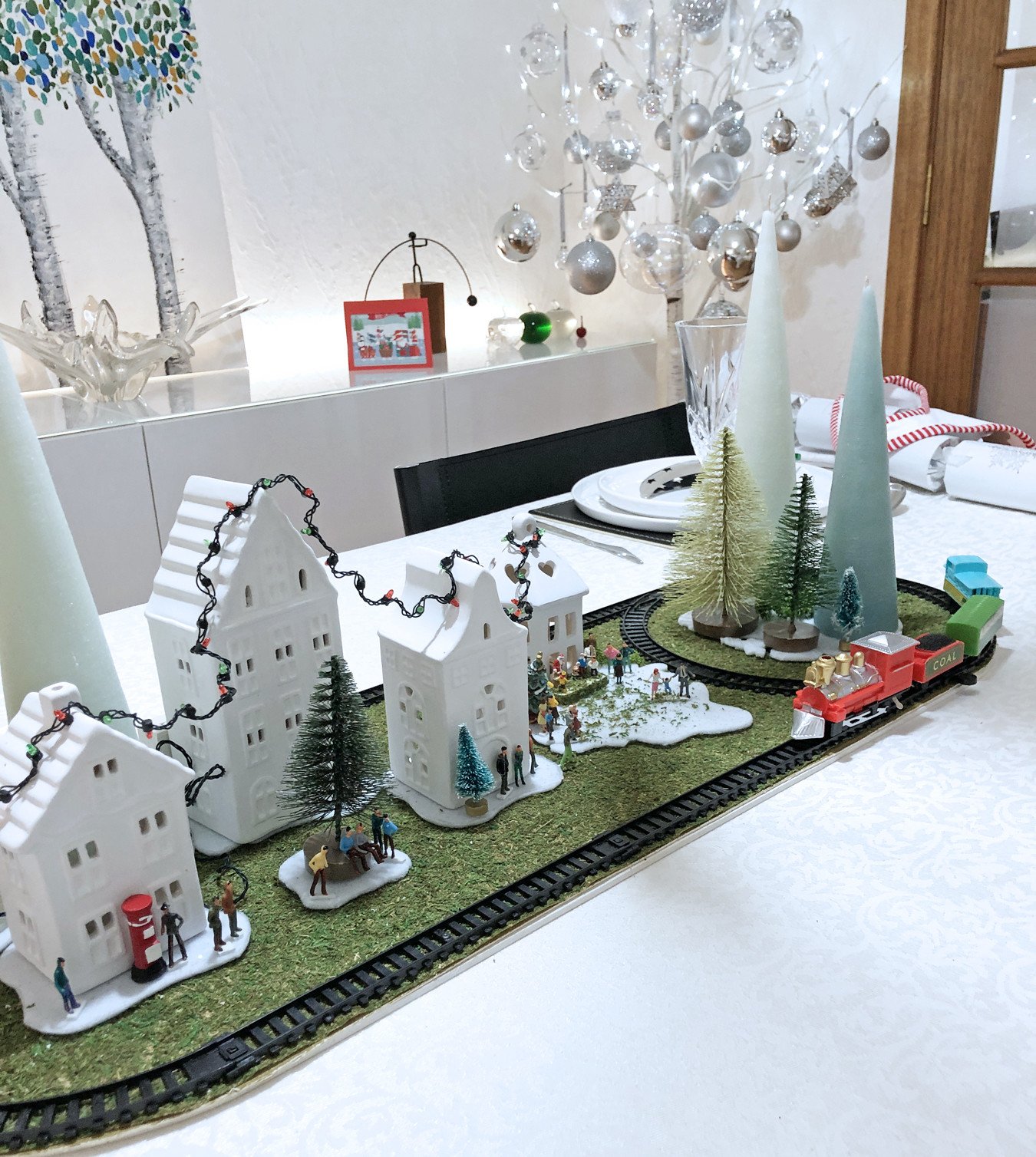 Christmas dinner table centrepiece with working train set