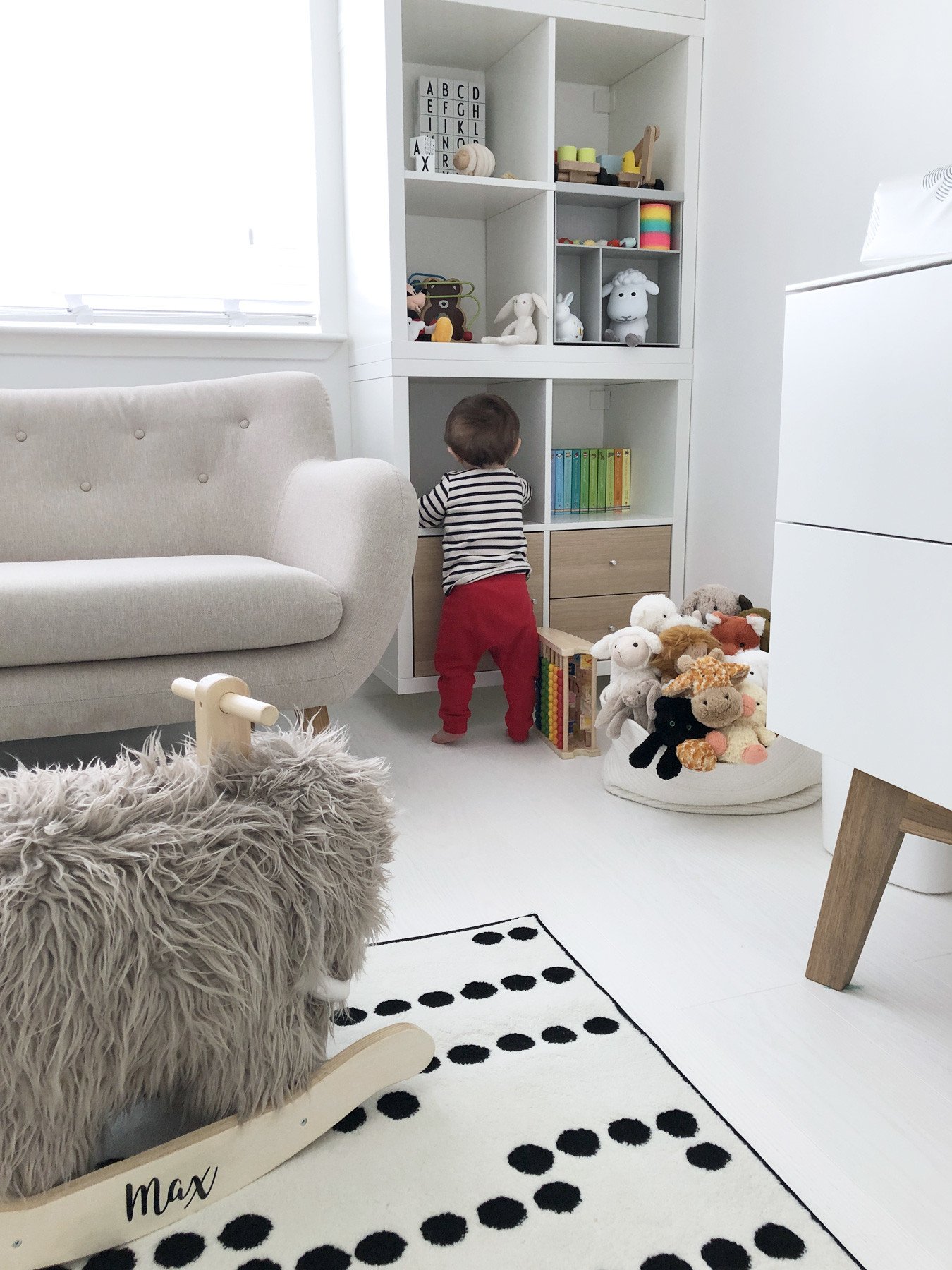 IKEA Kallax shelving unit in baby's bedroom