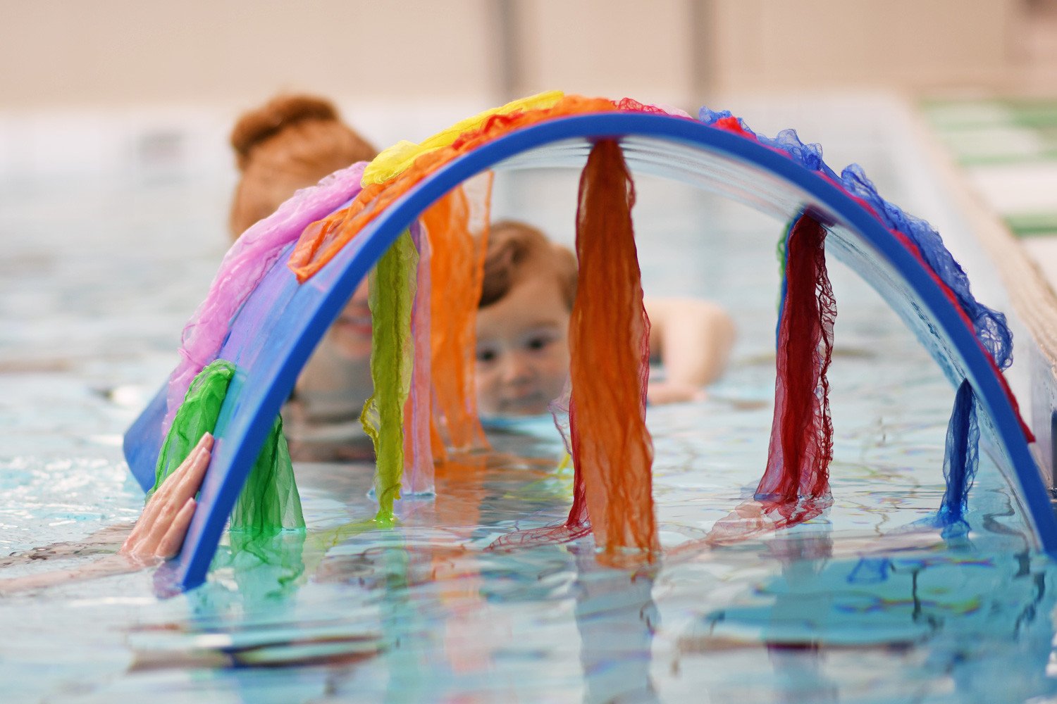 tunnel of scarves at baby swimming lessons