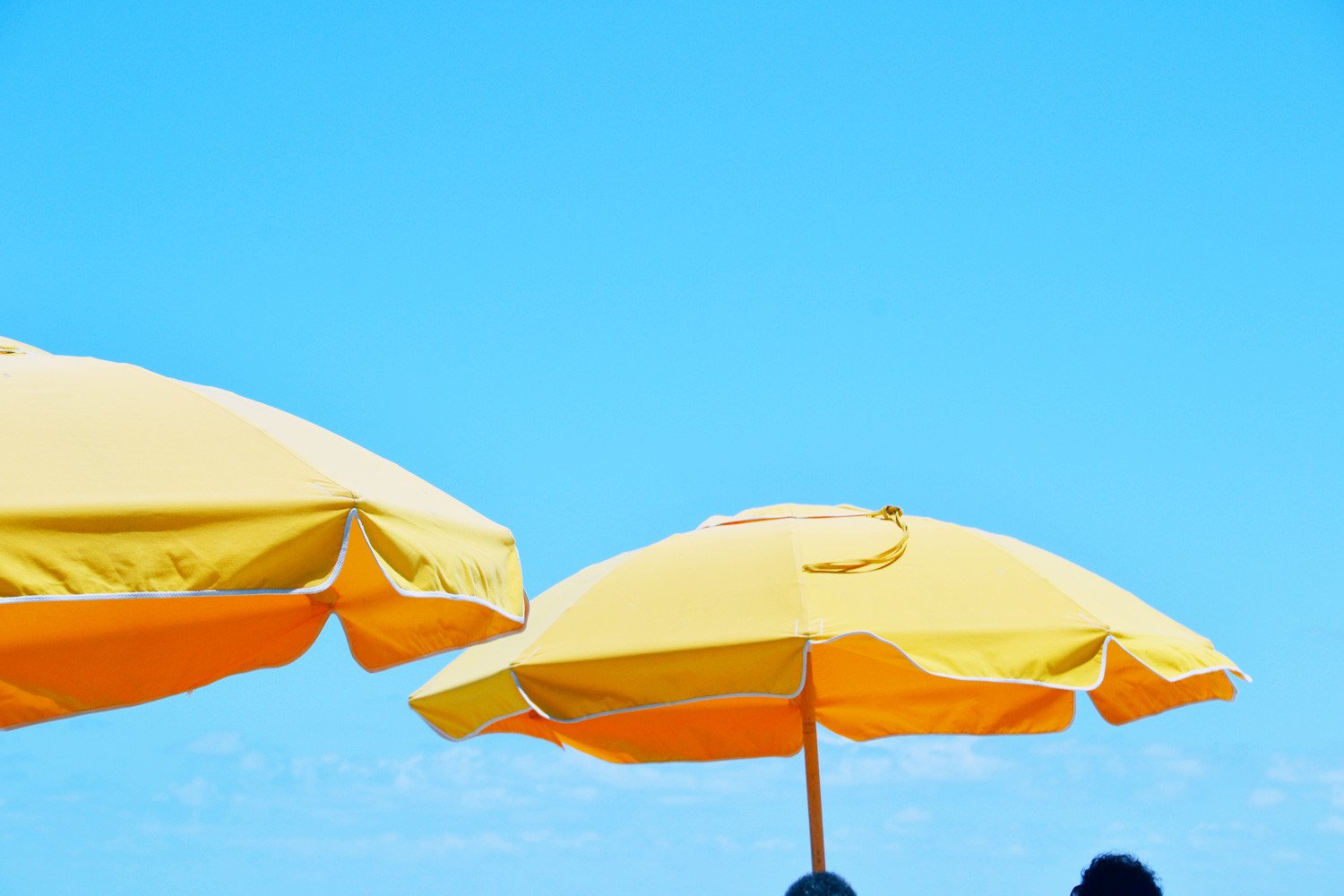 yellow umbrellas on Cocoa Beach