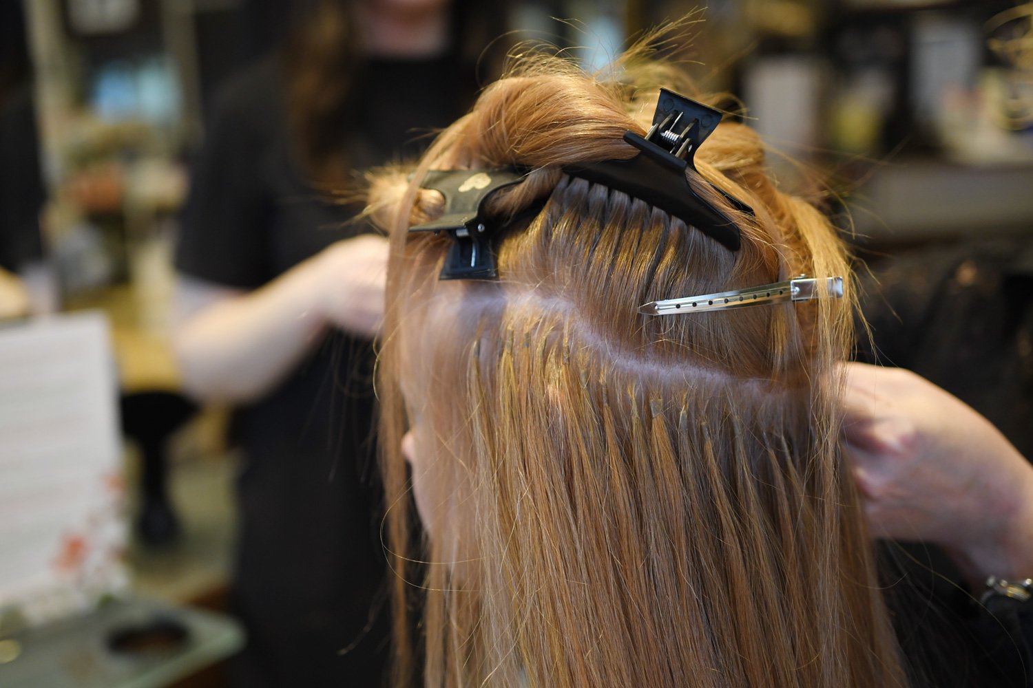 Great Length bonds being applied to hair 