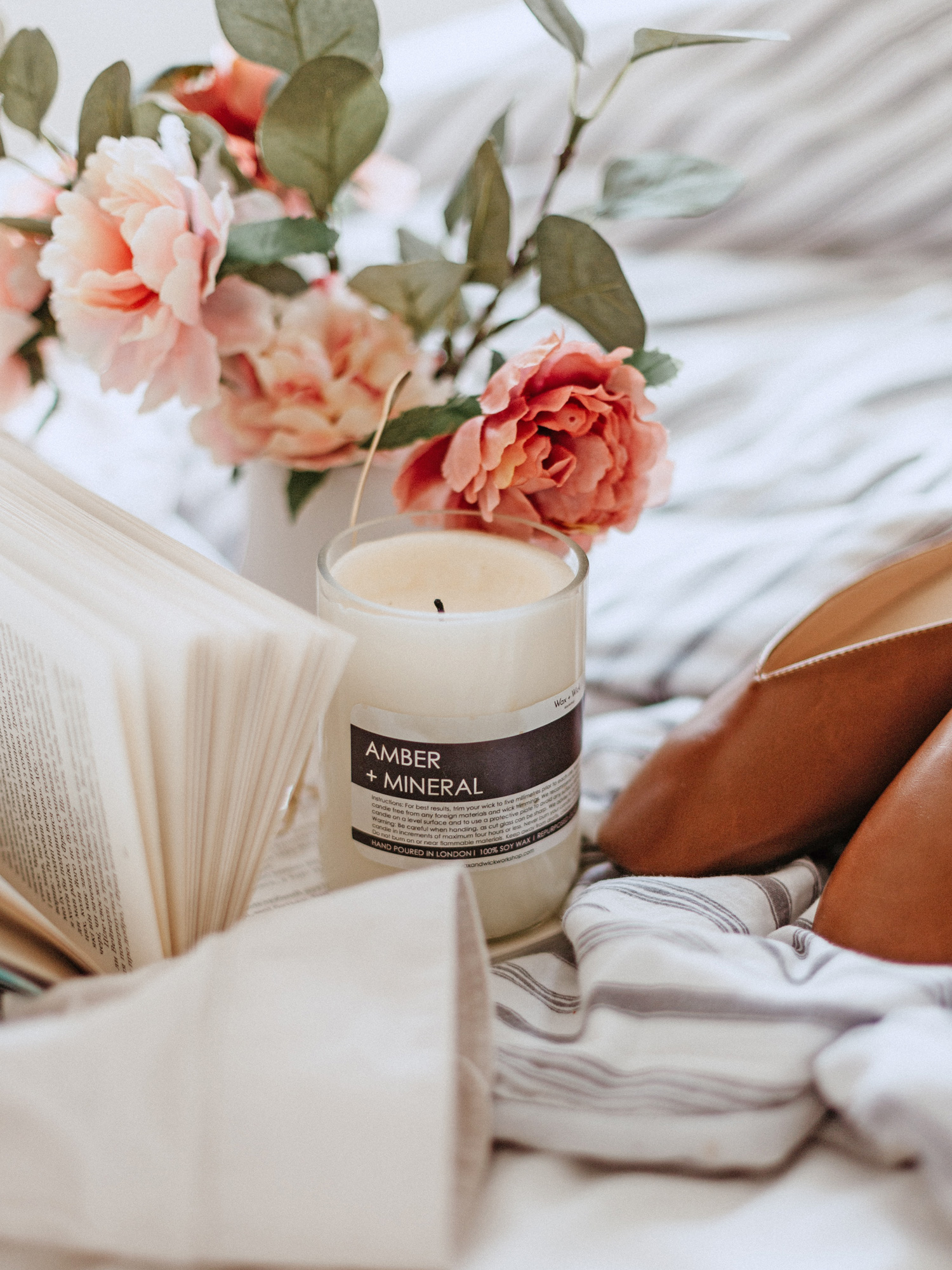book, flowers and candle