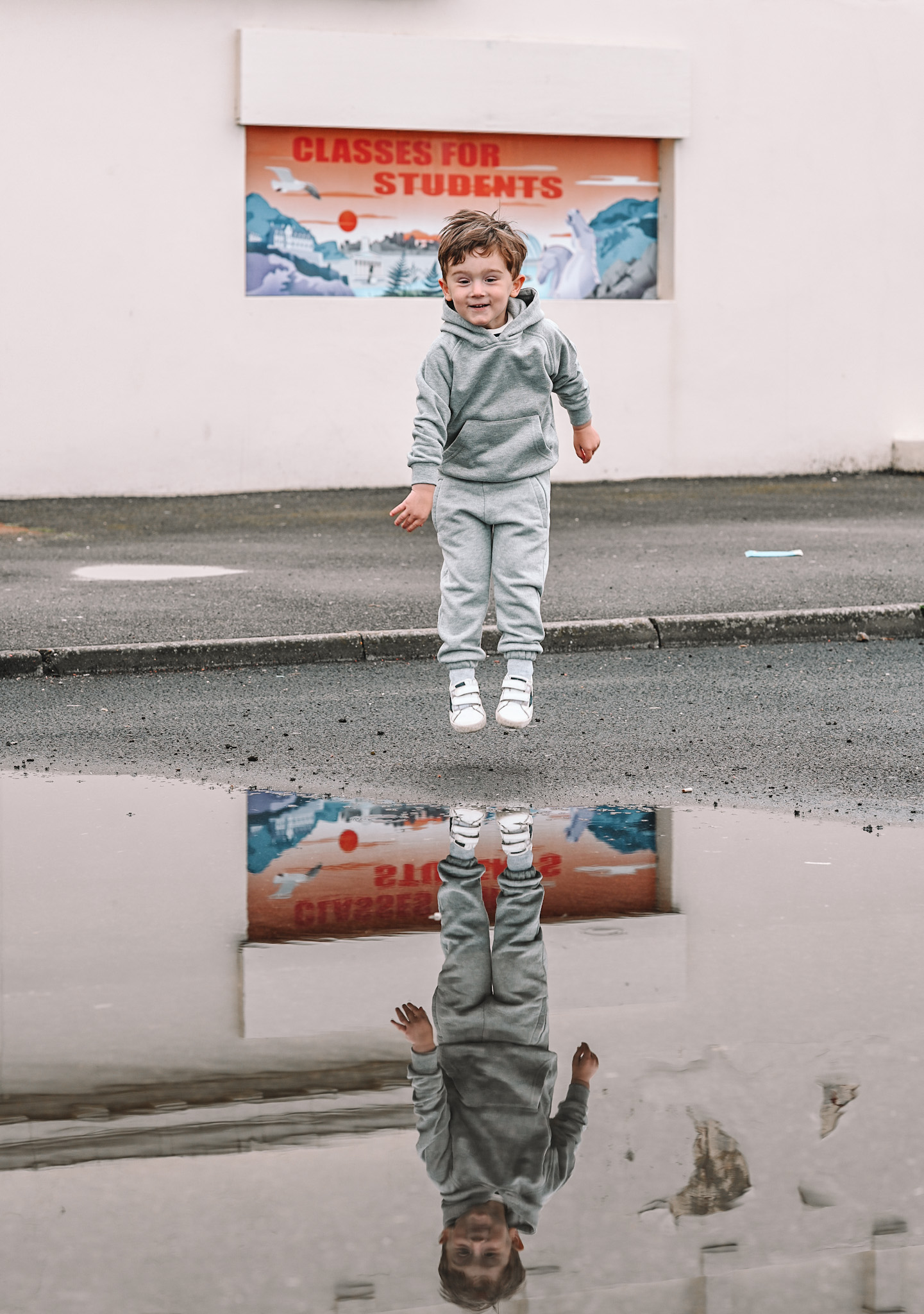 Max puddle jumping on a rainy day