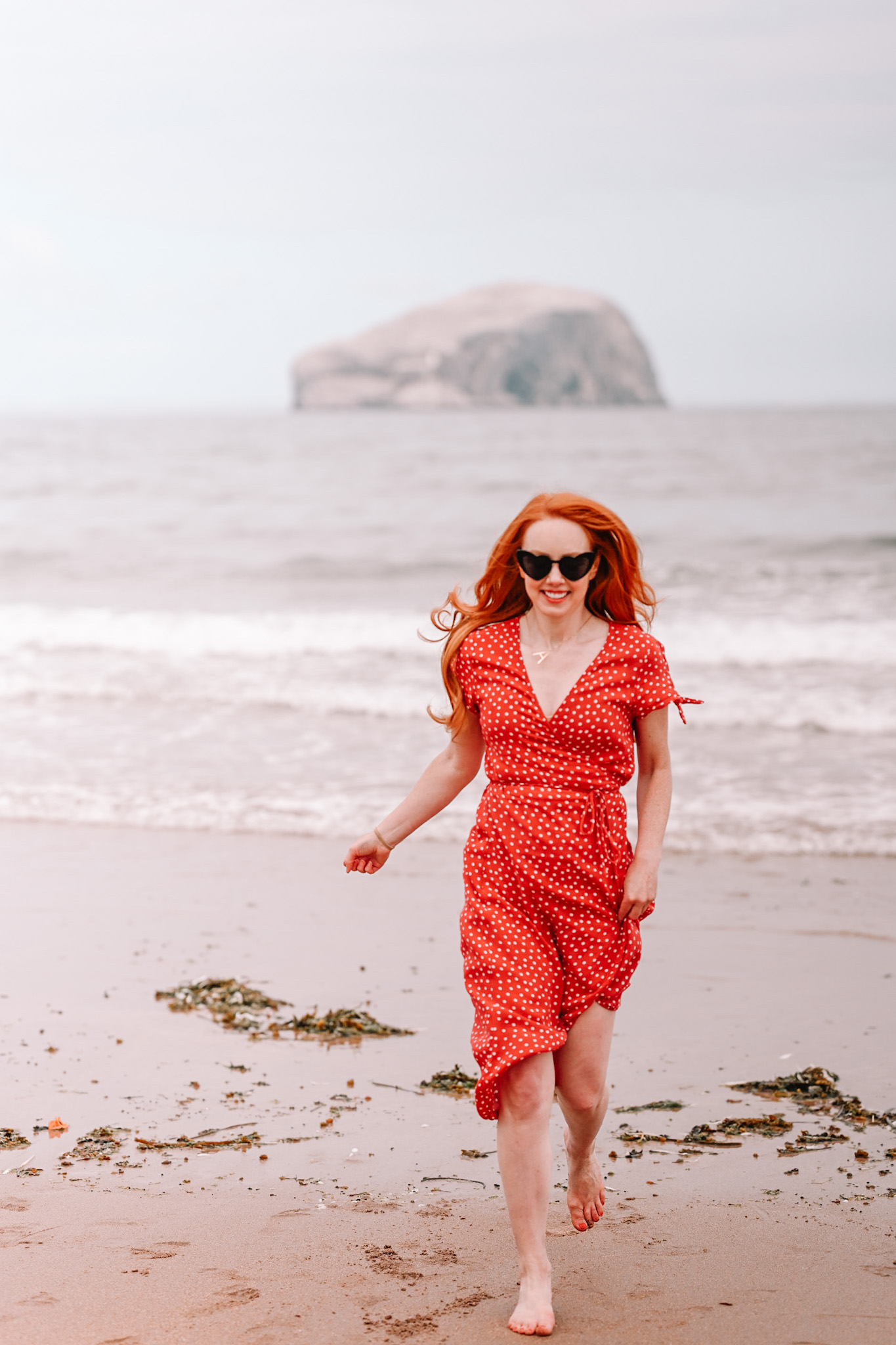 Amber in a red dress on the beach