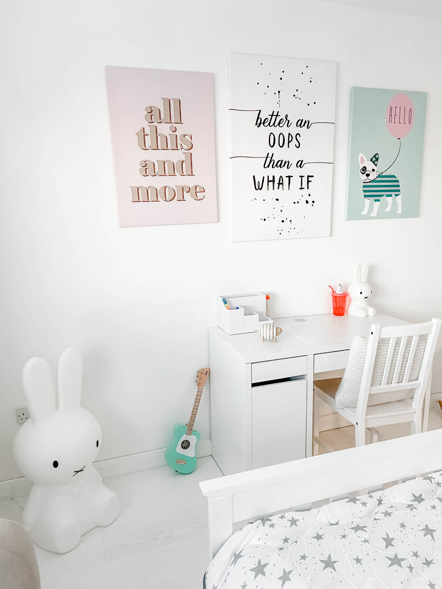 child's bedroom with desk and artwork