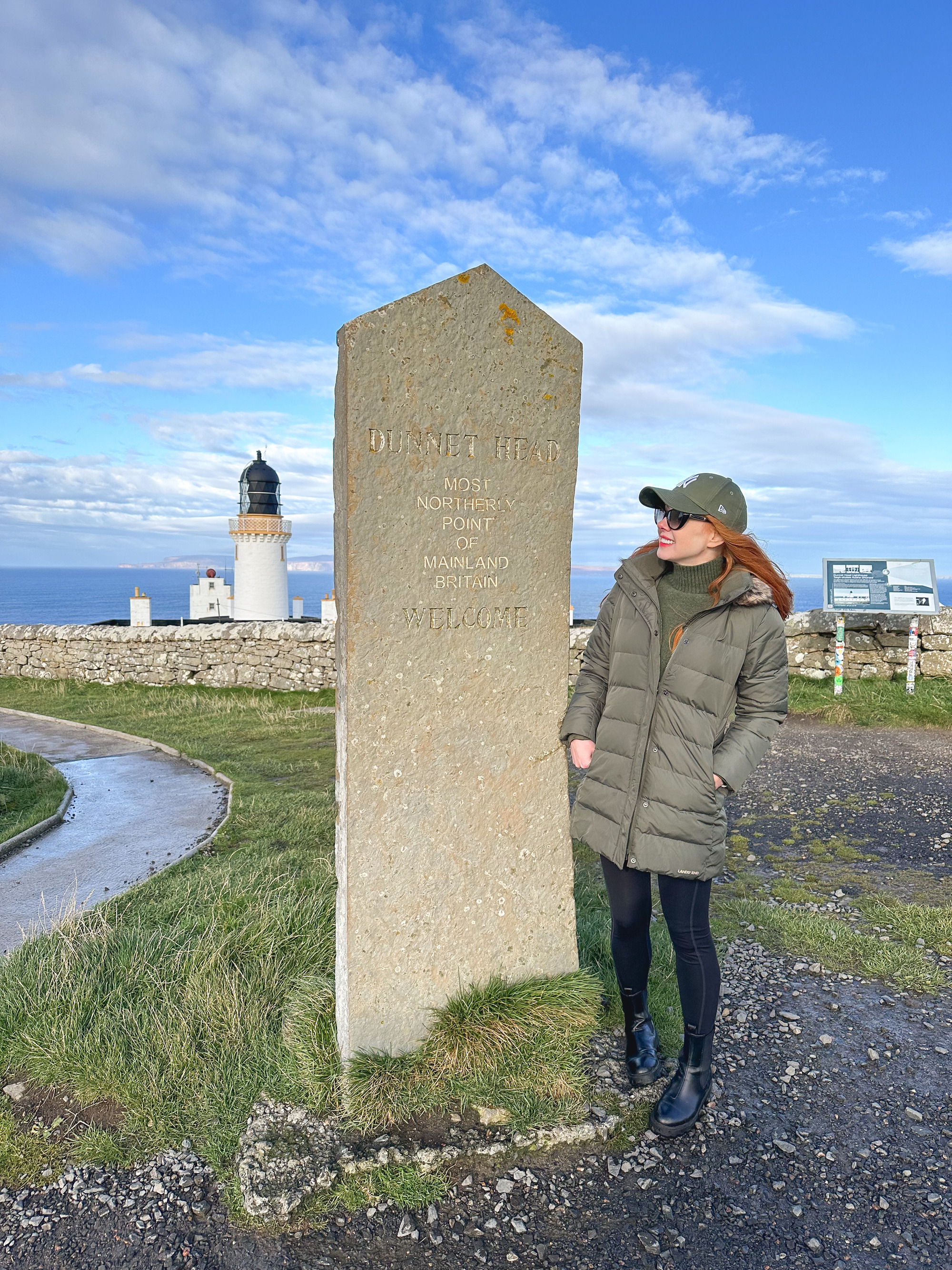 Amber at the Dunnet Head sign